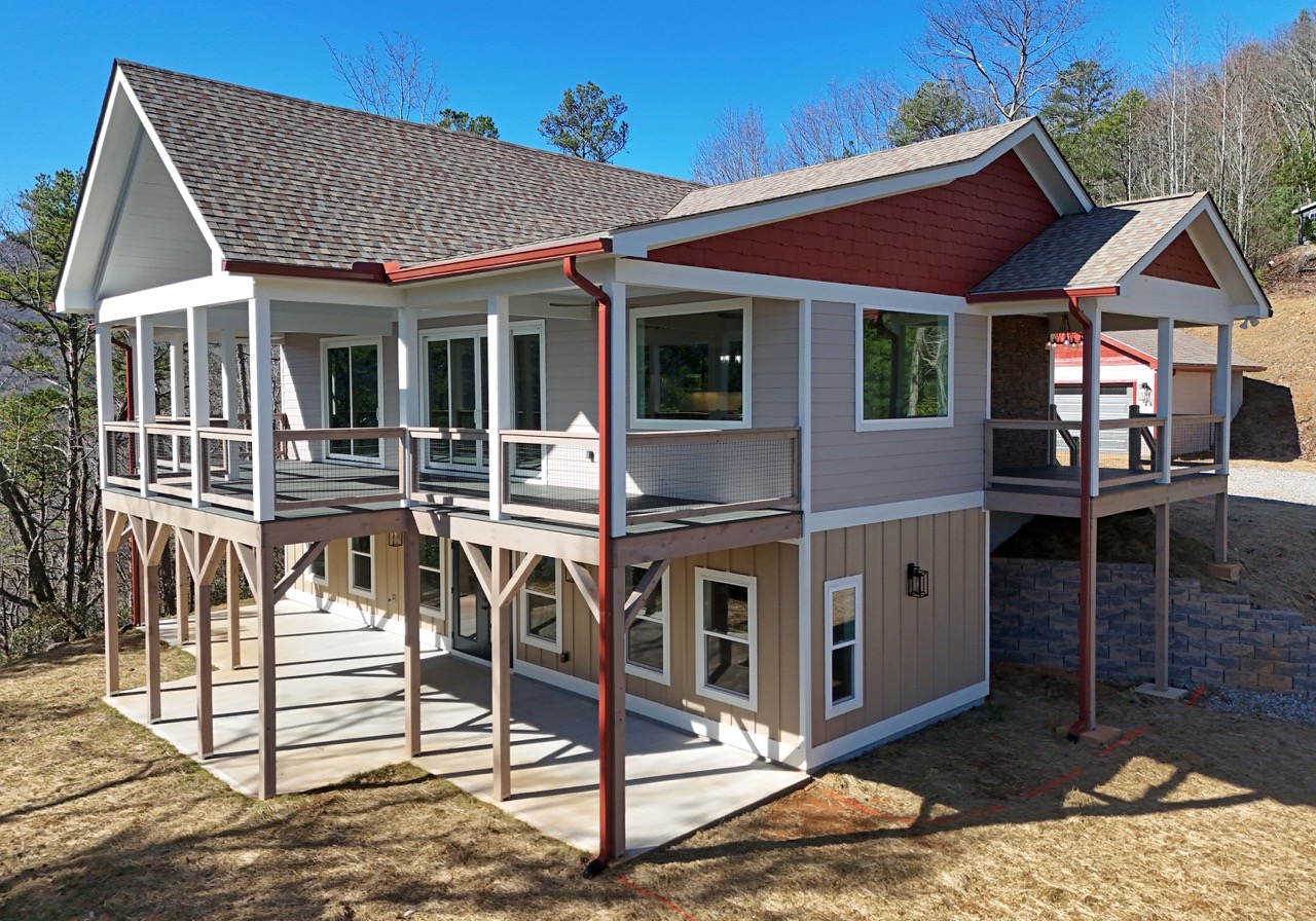 custom home with large wrap around balcony